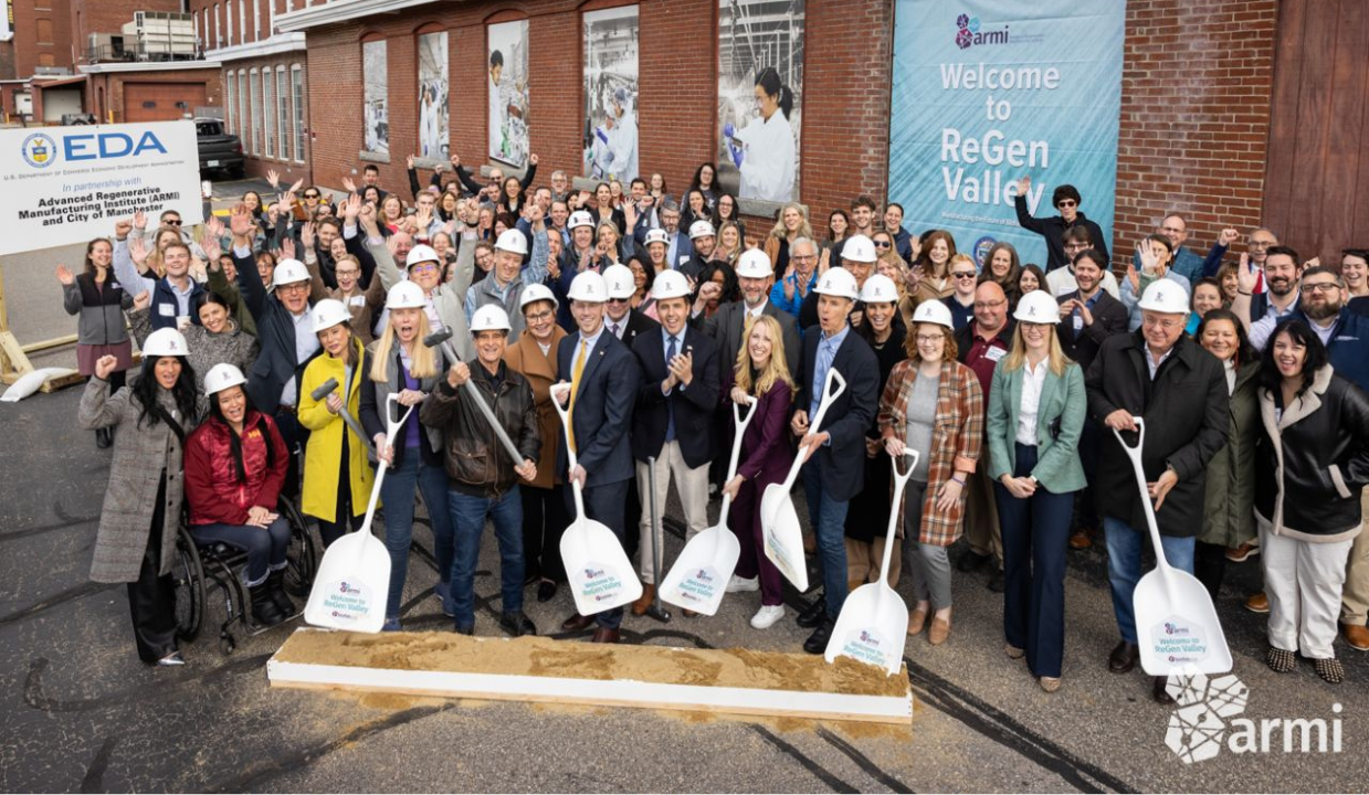 group of people with shovels posing for a breaking ground photo