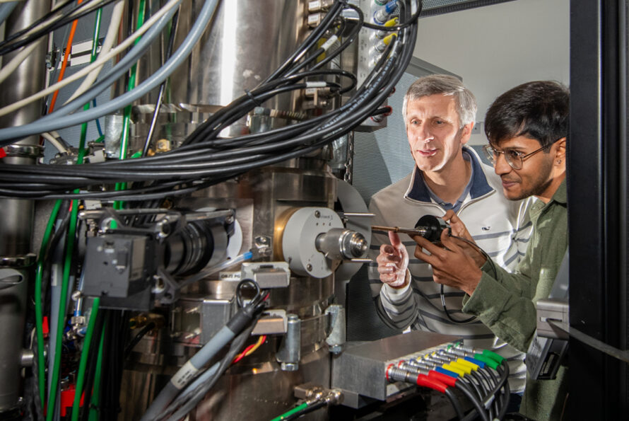 Two people looking at equipment